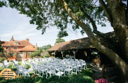 White Folding Chairs Side View Outside Ceremony