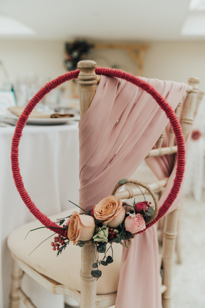 Floral hoop ceremony chair decor