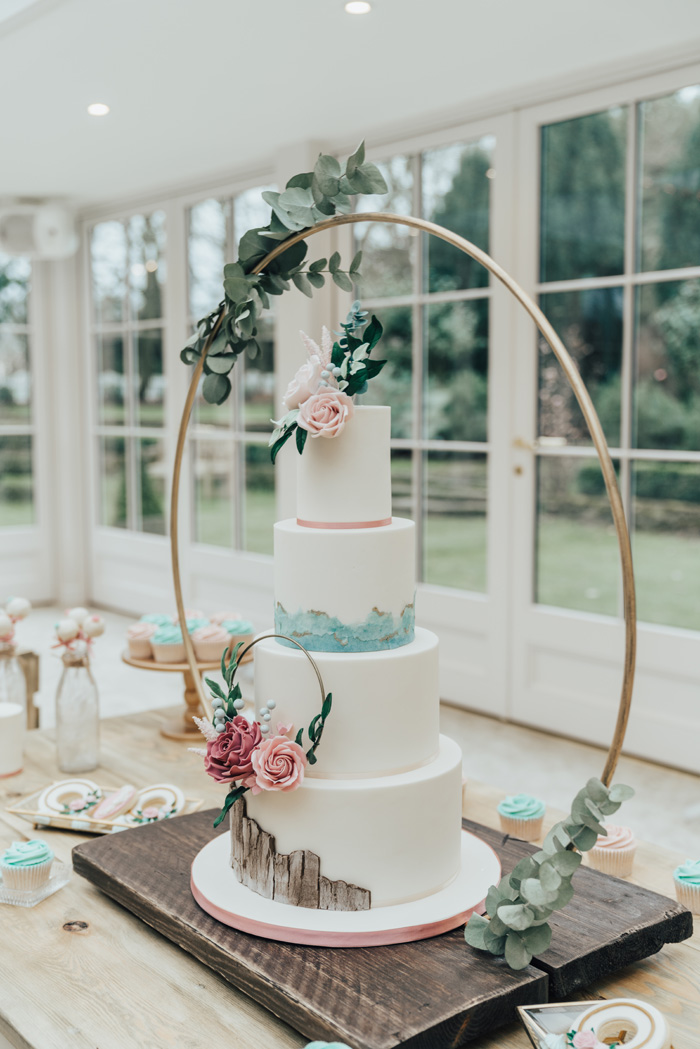 Greenery hoop wedding cake display